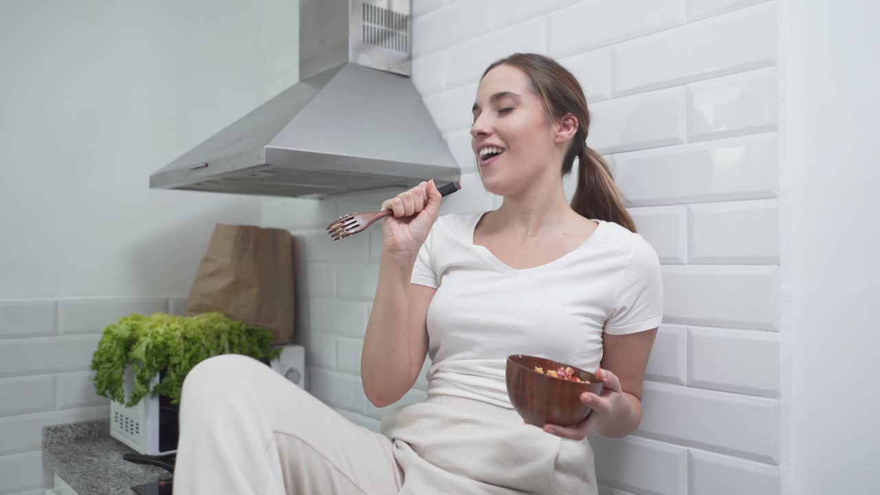 Woman enjoying a healthy meal in the kitchen