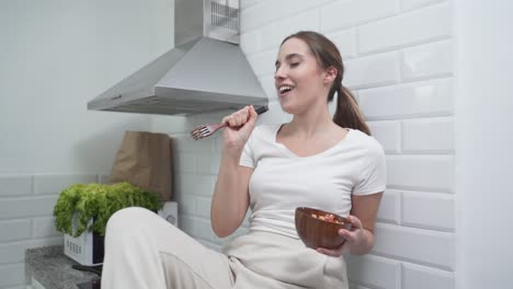 woman enjoying a healthy meal in the kitchen