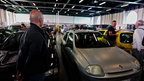 cars and people on a car ferry deck