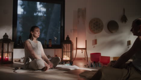 two women meditating in a spiritual room