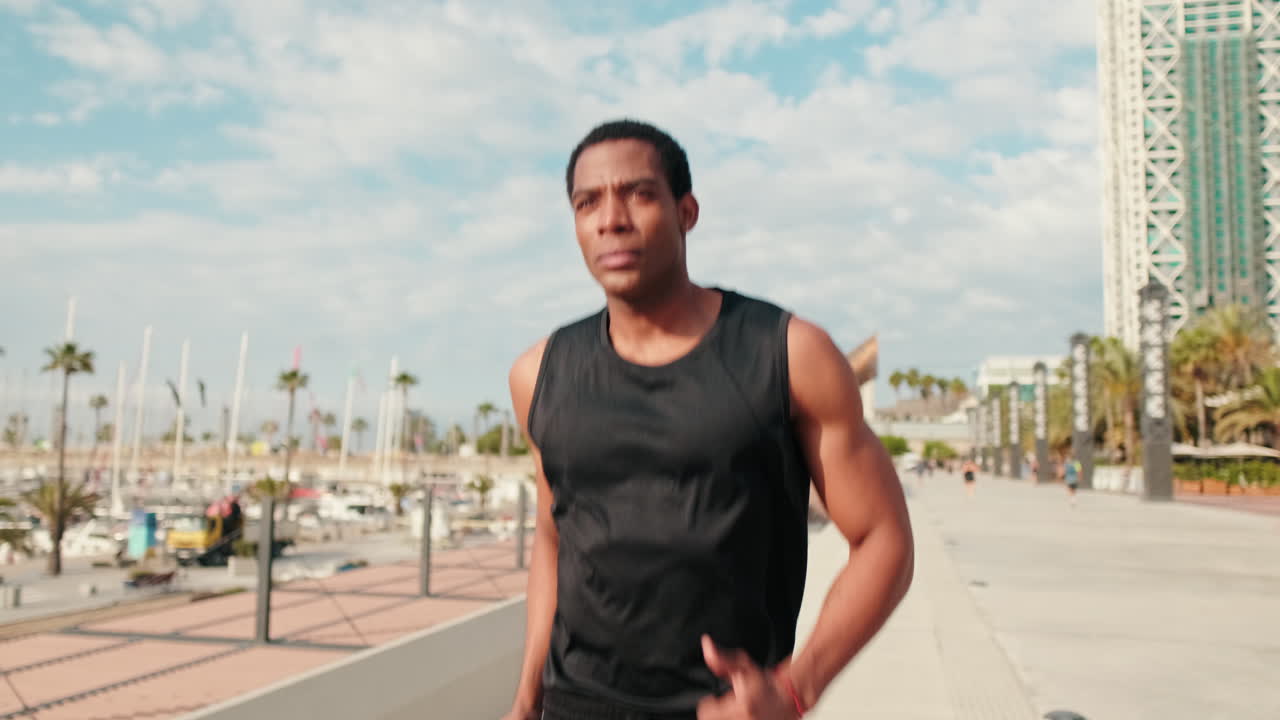 Man Jogging in the City on a Sunny Day