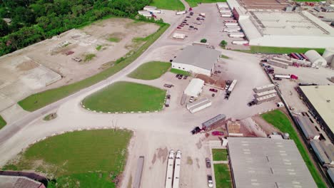 aerial view of a large industrial complex with numerous trucks