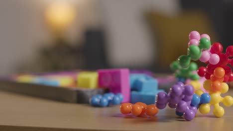 coloured interlocking shape puzzles on table at home for child diagnosed with asd 5