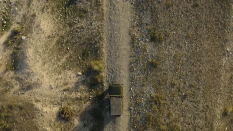 russian car driving off-road - drone top down following