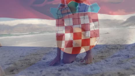 Animación-De-La-Bandera-De-Croacia-Sobre-Una-Familia-Caucásica-En-La-Playa.