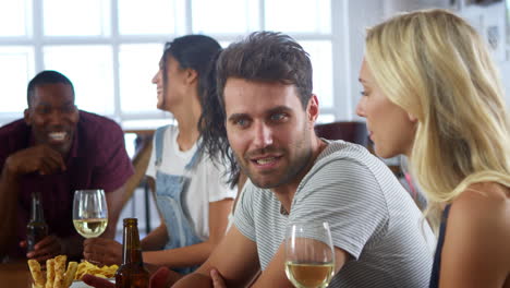 Group-Of-Friends-Enjoying-Dinner-Party-At-Home-Together