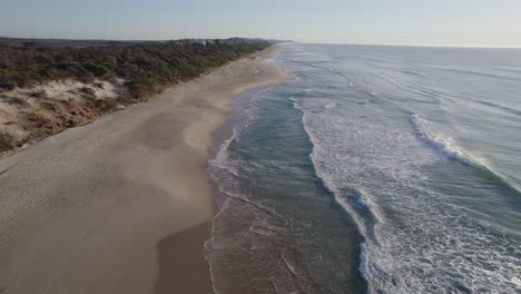 coolum beach with scenic seascape in sunshine coast, queensland, australia - drone shot