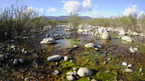 Wide-angle-dolly-shot-of-spring-clouds-passing-over-the-Los-Padres-National-Forest-and-the-Ventura-River-in-Ojai-California