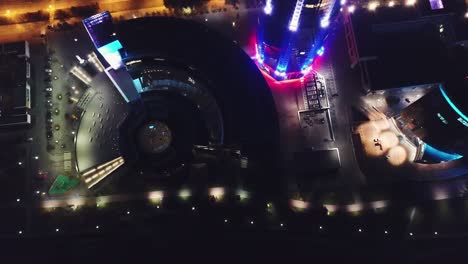 aerial view of illuminated city buildings at night