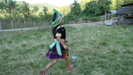 girl in traditional clothing in a rural setting
