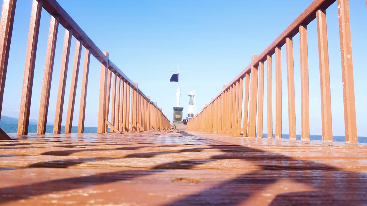 Wooden Pier Leading to Lighthouse
