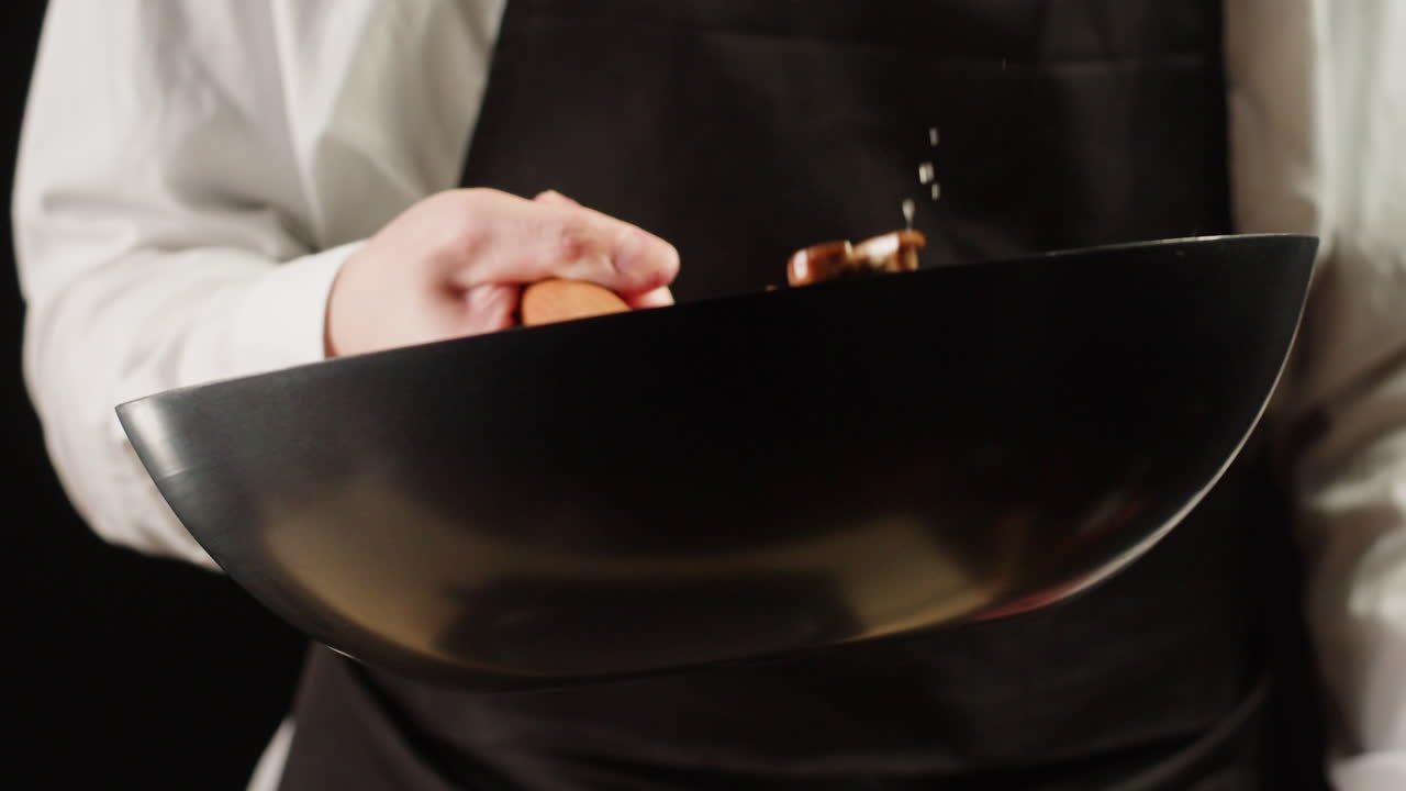 Chef cooking with a wok