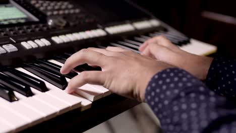 Close-up-of-hands-playing-the-grand-piano