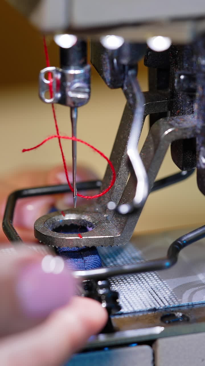 Sewing modern machine close up. Textile needle sewing equipment. Vertical video