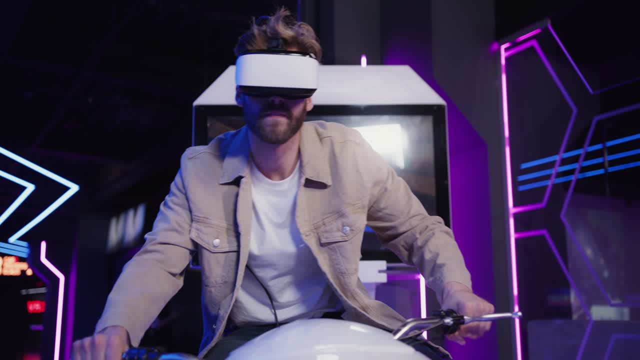 Man experiencing virtual reality bike ride in an arcade