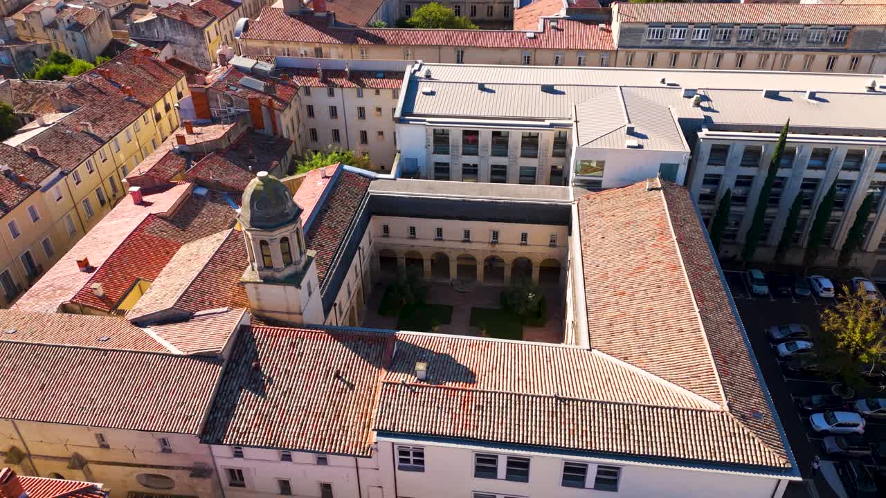 Aerial establishing shot of a courtyard within downtown Montpellier
