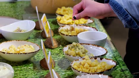 close up on different varieties of cheese tasting, with hands take the cheese in 4k