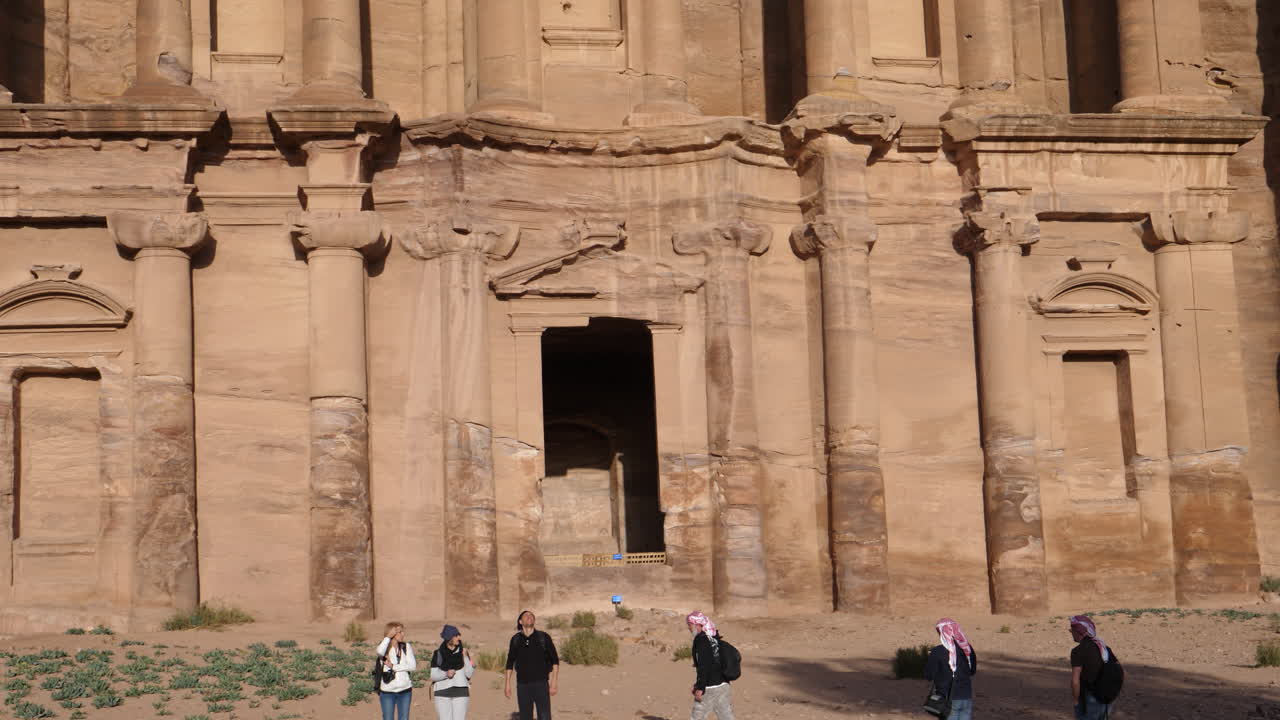 Tilt down of facade main entrance of most important tourist travel attraction in the old ancient city of Petra in Jordan