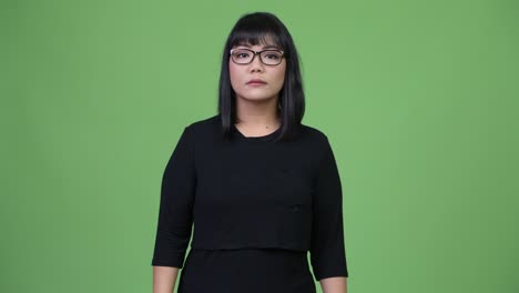 beautiful asian businesswoman with arms crossed