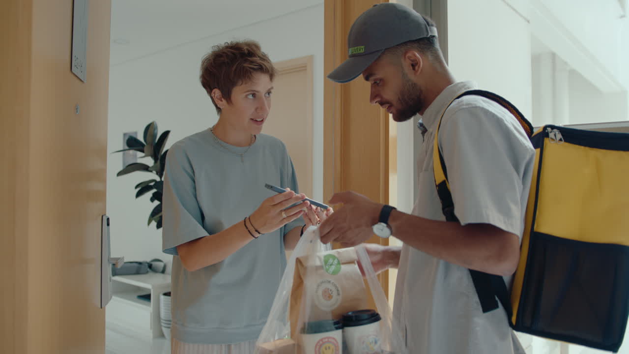 Courier Delivering Restaurant Food and Drinks to Female Customer