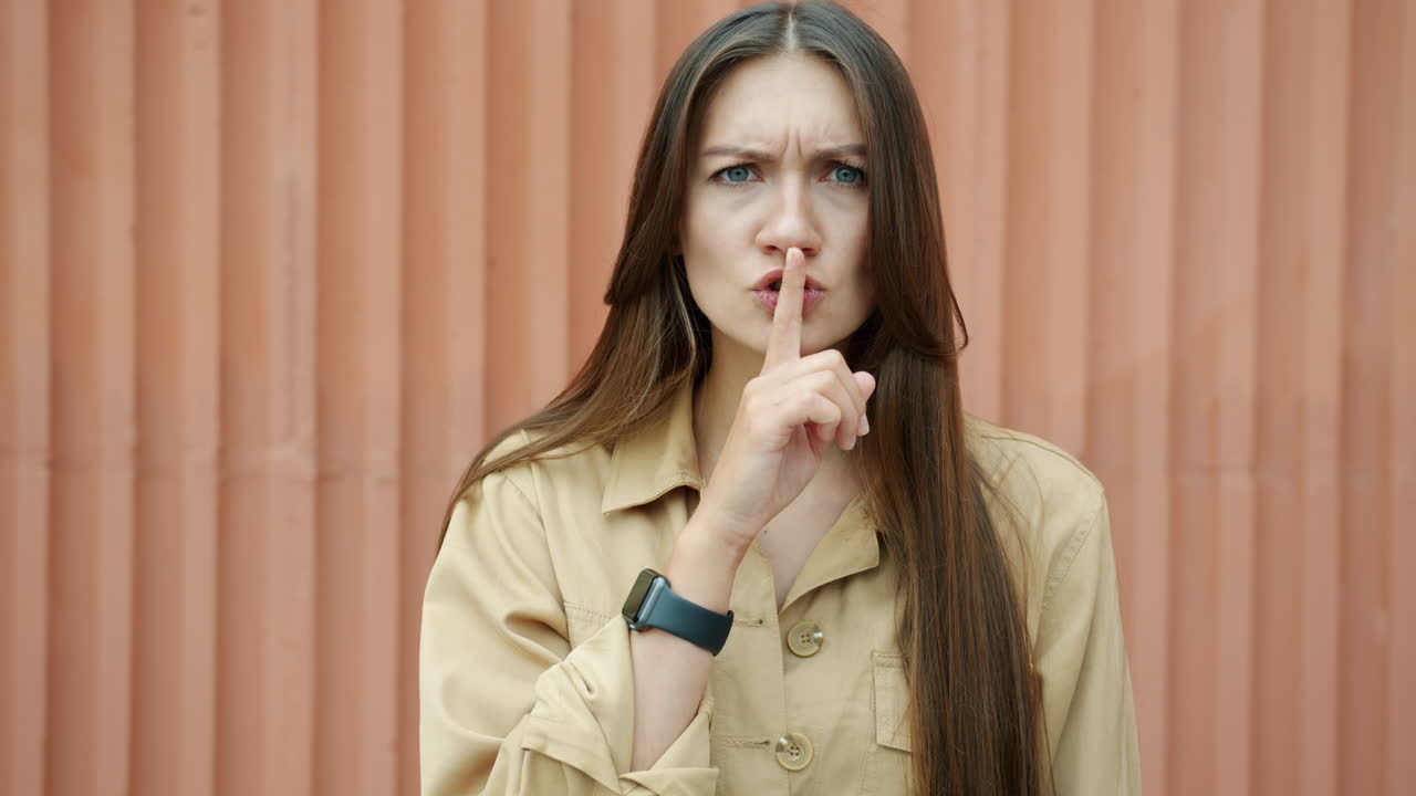 Woman with Finger on Lips