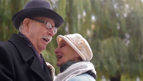 old european man and woman dancing together in park standing old european man and woman dancing together in park standing healthy lifestyle concept