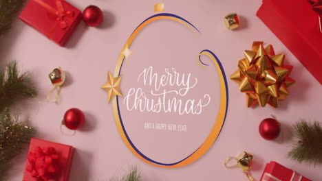 animación del texto de feliz navidad sobre las decoraciones navideñas