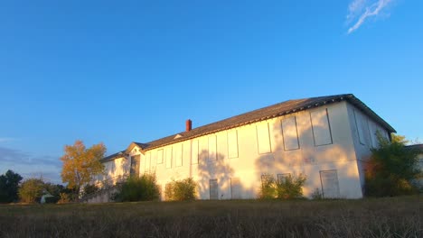 timelapse - an old abandoned hospital in a small town on a sunny day