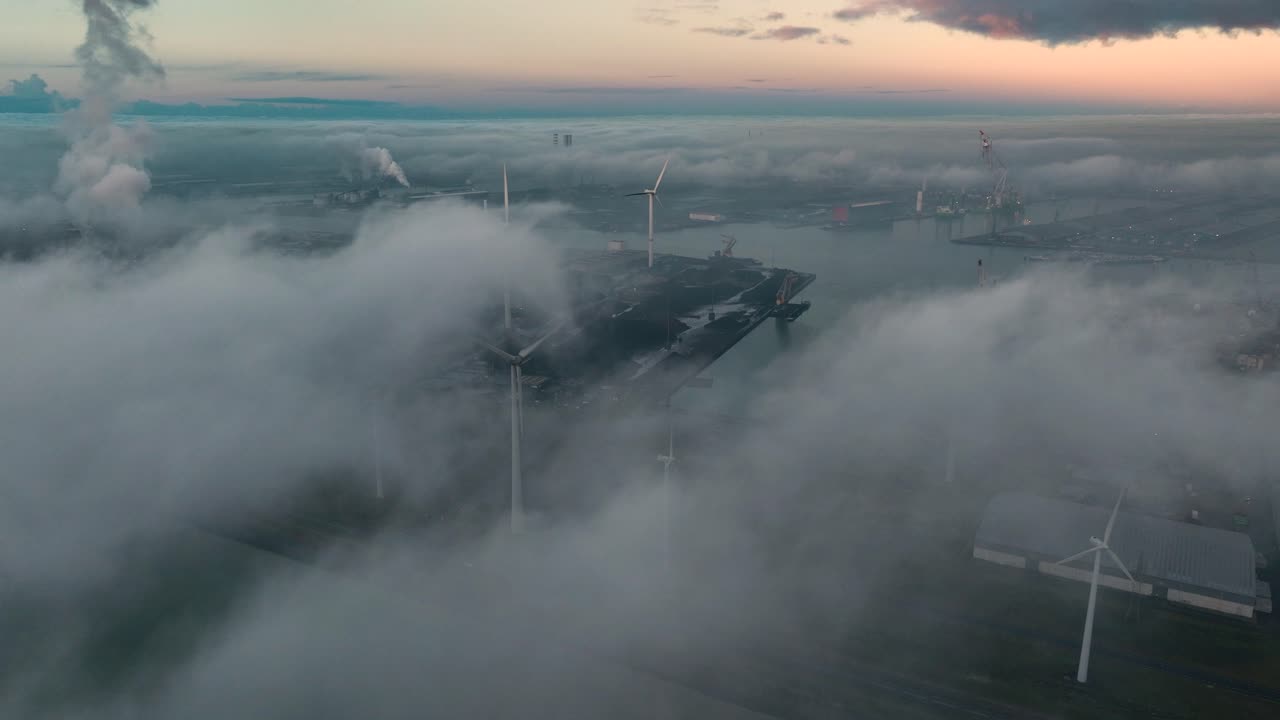 Curious drone flight at port of Vlissingen above temperature inversion - view of many wind turbines, Zeeland, Netherlands