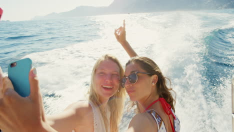 two friends taking a selfie on a boat