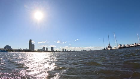 boats and skyline under bright sun