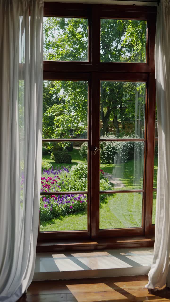 A serene garden view through a window, captured from a low angle