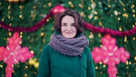 woman in front of a christmas tree