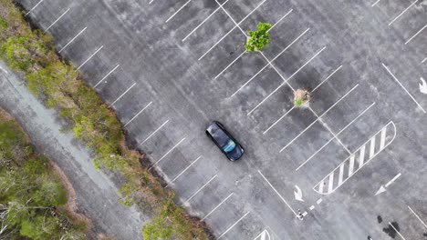 aerial view of tesla in deserted parking lot