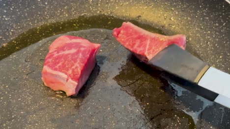 wagyu steak sizzling on a hot grill