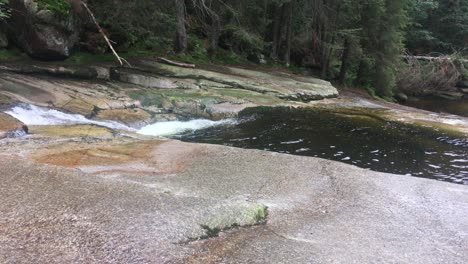 panning with dangerous certova oka geological formations and small ponds in giant mountains in mumlava river