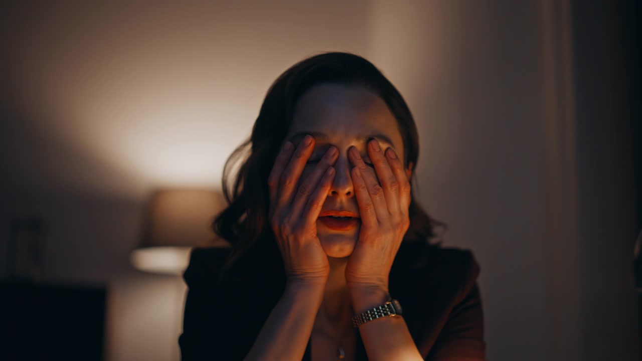 Overloaded employee reviewing documents at night workplace closeup. Tired woman