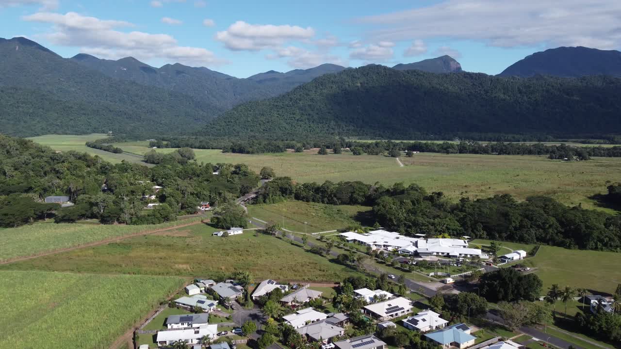 4K Aerial view of a sugarcane farm near a small rural Australian Town in North Queensland