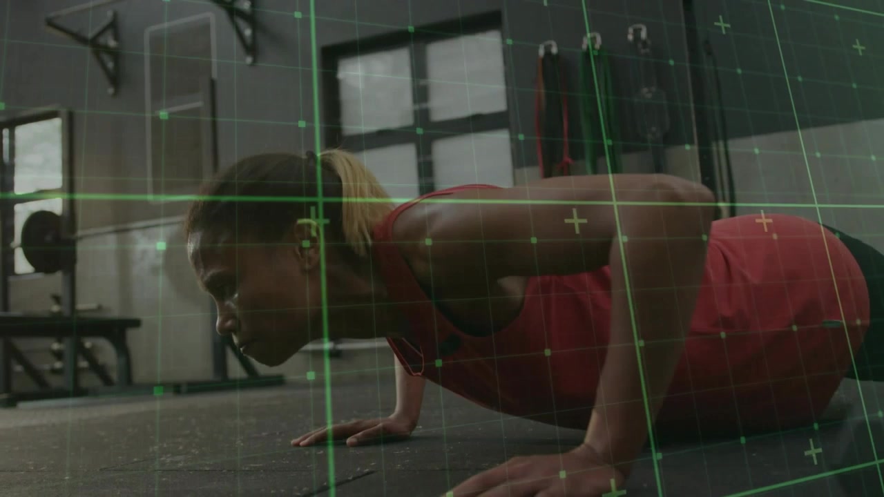 Vertical video: Starting plank, woman in red tank doing pushups on mat for strength, green grid