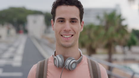 portrait attractive young hispanic man student smiling enjoying successful vacation lifestyle relaxed male in urban city