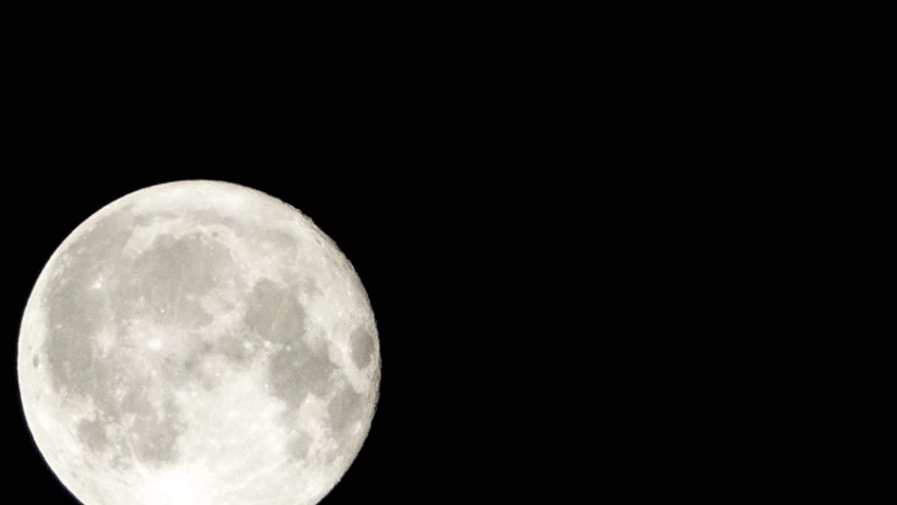 Full moon passing by