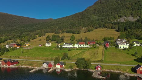 aerial over syvde waterfront on a lovely sunny day, vanylven municipality, norway