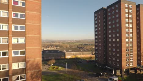 aerial footage view of high rise tower blocks, flats built in the city of stoke on trent to accommodate the increasing population, council housing crisis, immigration housing