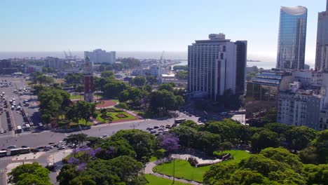 vista aerea dolly in del monumento a los caidos en la guerra de malvinas y la torre monumental en el barrio de retiro, buenos aires