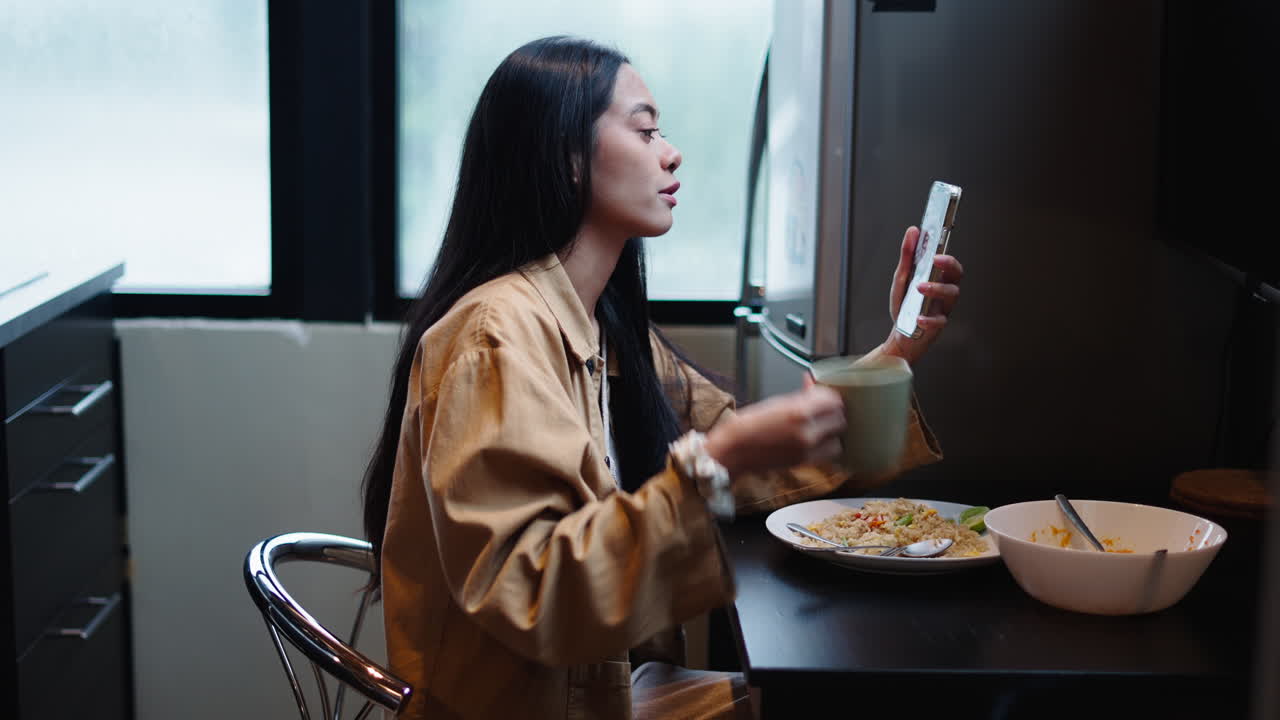 Woman on a video call in the kitchen