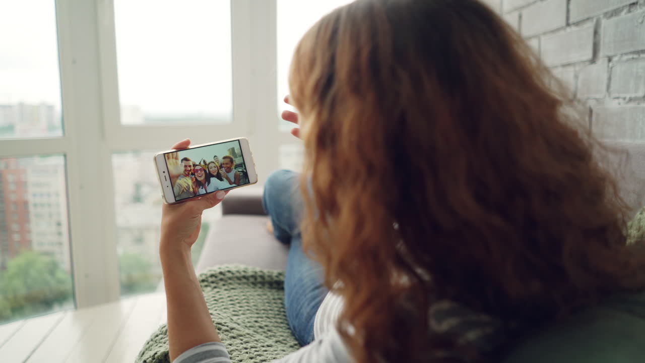 Woman having a video call with her family