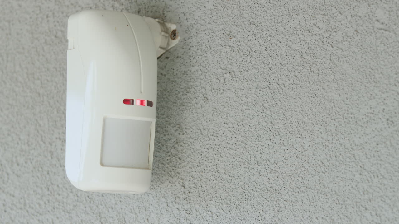 Motion sensor on the wall of the house. LED indicators light up to detect movement