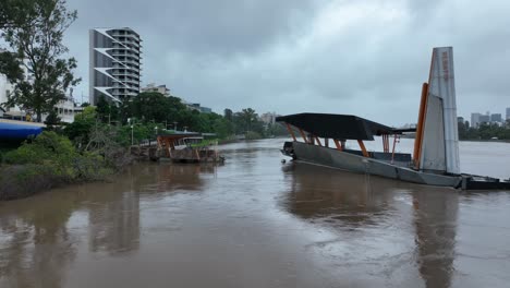 Low-angle-drone-shot-of-destroyed-city-cat-boat-ferry-terminal-3