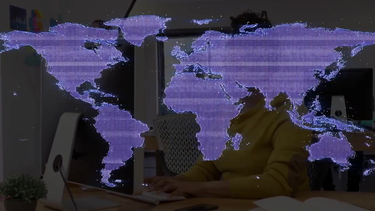 Seated woman adjusting and typing, purple world map overlay guiding business task