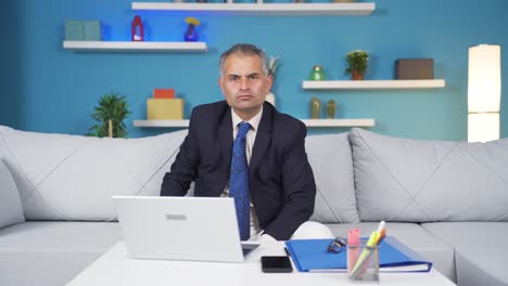 Home-office-worker-man-says-stop-to-camera,-warns.